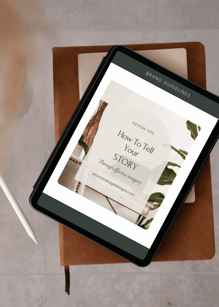 Brand guidelines displayed on a tablet that is stacked on a journal.
