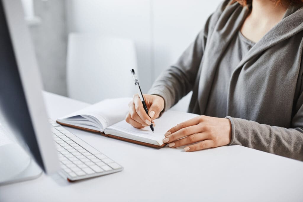 Woman writing in notebook